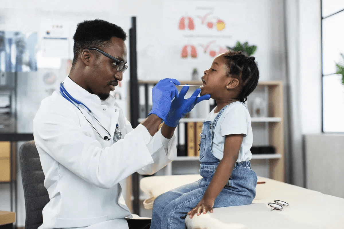 Doctor examining child